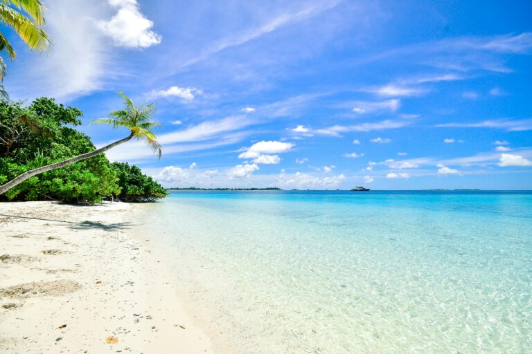 Stunning beach in Laamu Atoll, Maldives, with turquoise waters and clear skies.